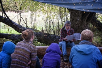 Jane reading at Magor forest school