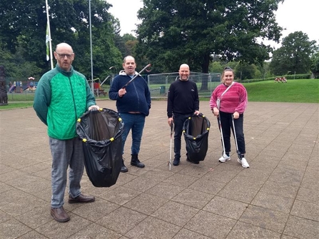 Image of participants and staff from Aderyn with litter pickers and bags at Pontypool Park