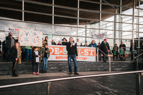 GWT CEO Adam Taylor speaks to demonstrators at the Senedd