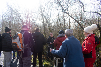 Wild Health project officer Ian Thomas (in the centre/facing) leading a nature walk