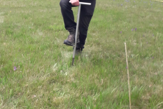 Andy Karran collecting soil samples for eDNA