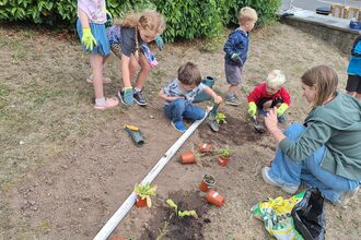 Children planting a community garden in Pontypool