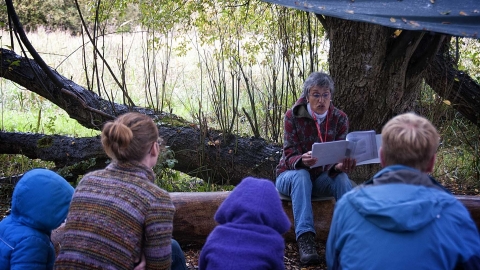 Jane reading at Magor forest school