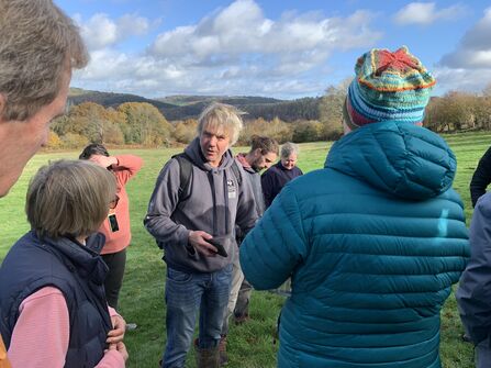 People listening to Joe give a talk at Wyeswood Common