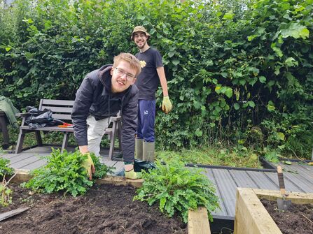 Wildlife Warrior youth group planting a raised bed