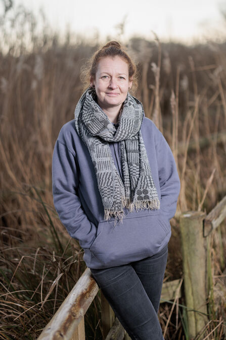 Gemma Bodé standing against a fence at Magor Marsh 