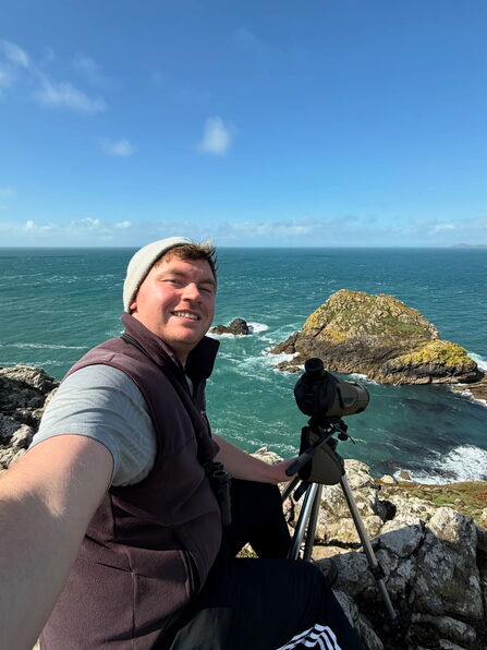 Joe Wilkins on the coast with a camera