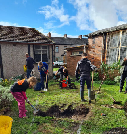 Children digging in a community garden