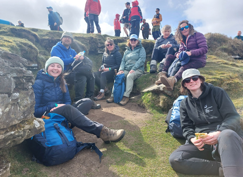 Walkers on top of the Sugarloaf Pen y Fal