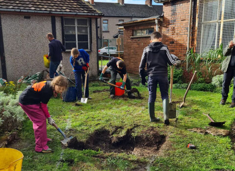 Children digging in a community garden